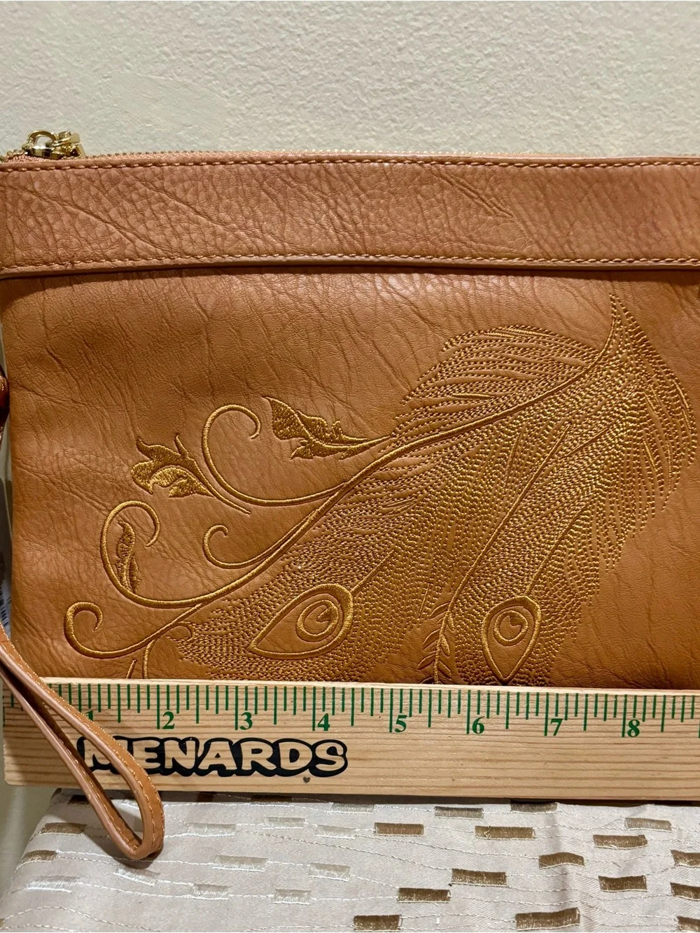 Charming Charlie Tan Wristlet Clutch with Embossed Feather Motif